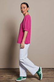 Model Katie wearing size 10 of the Gathered Sleeve Top in colour Magenta (Pink), from the front, showing the whole outfit