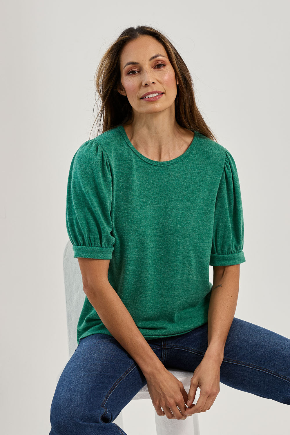 Model Amanda wearing size 10 of the Gathered Sleeve Top in colour Vividgreen (Green), from the front, showing the whole outfit