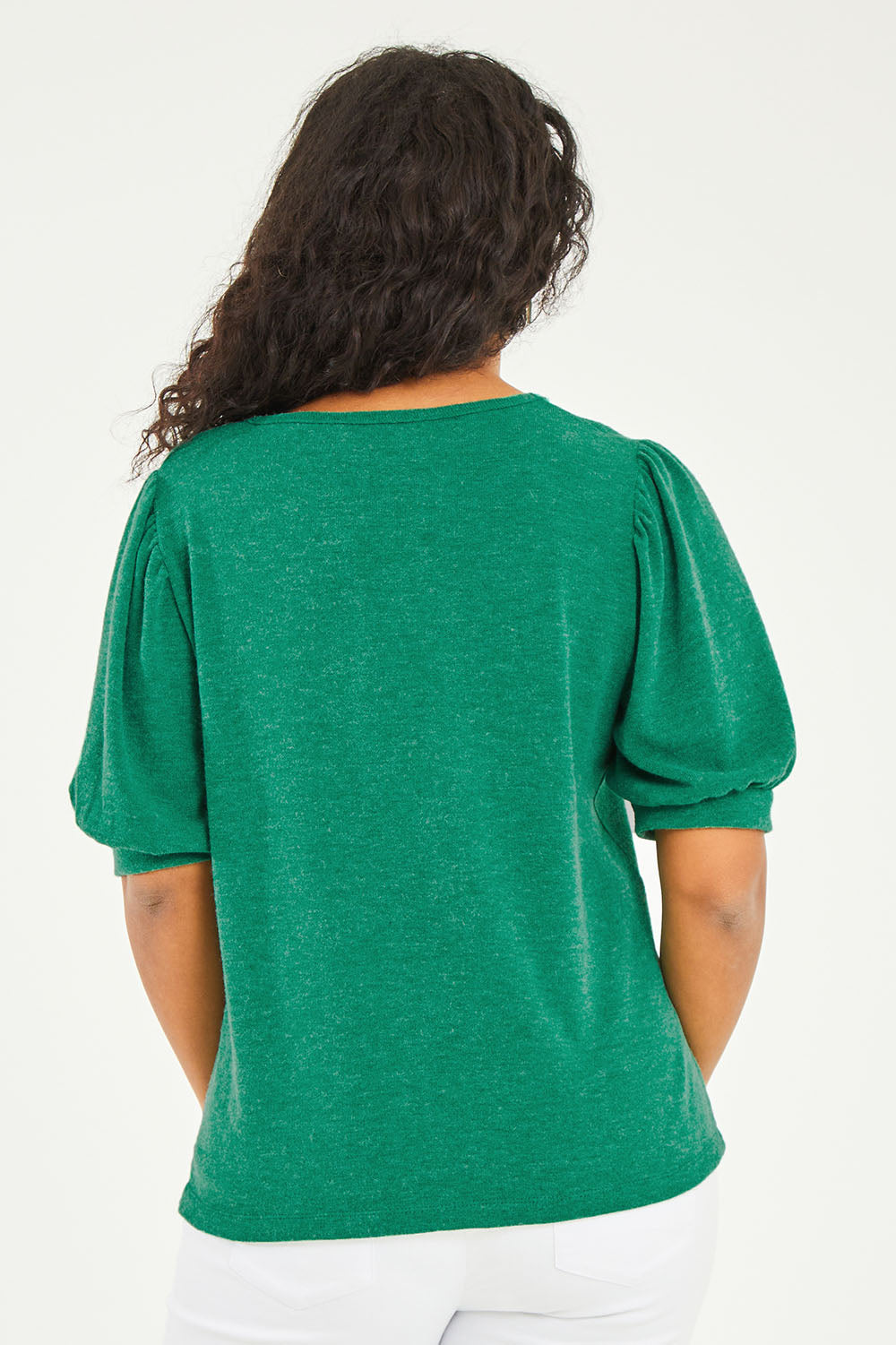 Model Noli wearing size 14 of the Gathered Sleeve Top in colour Vividgreen (Green), from the back