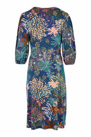Product shot of the Gathered Waist Faux Wrap Dress in colour Wonderland (Blue), from the back