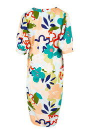 Product shot of the V Neck Gathered Sleeve Calf Length Dress in colour Blossoms (Blue), from the back