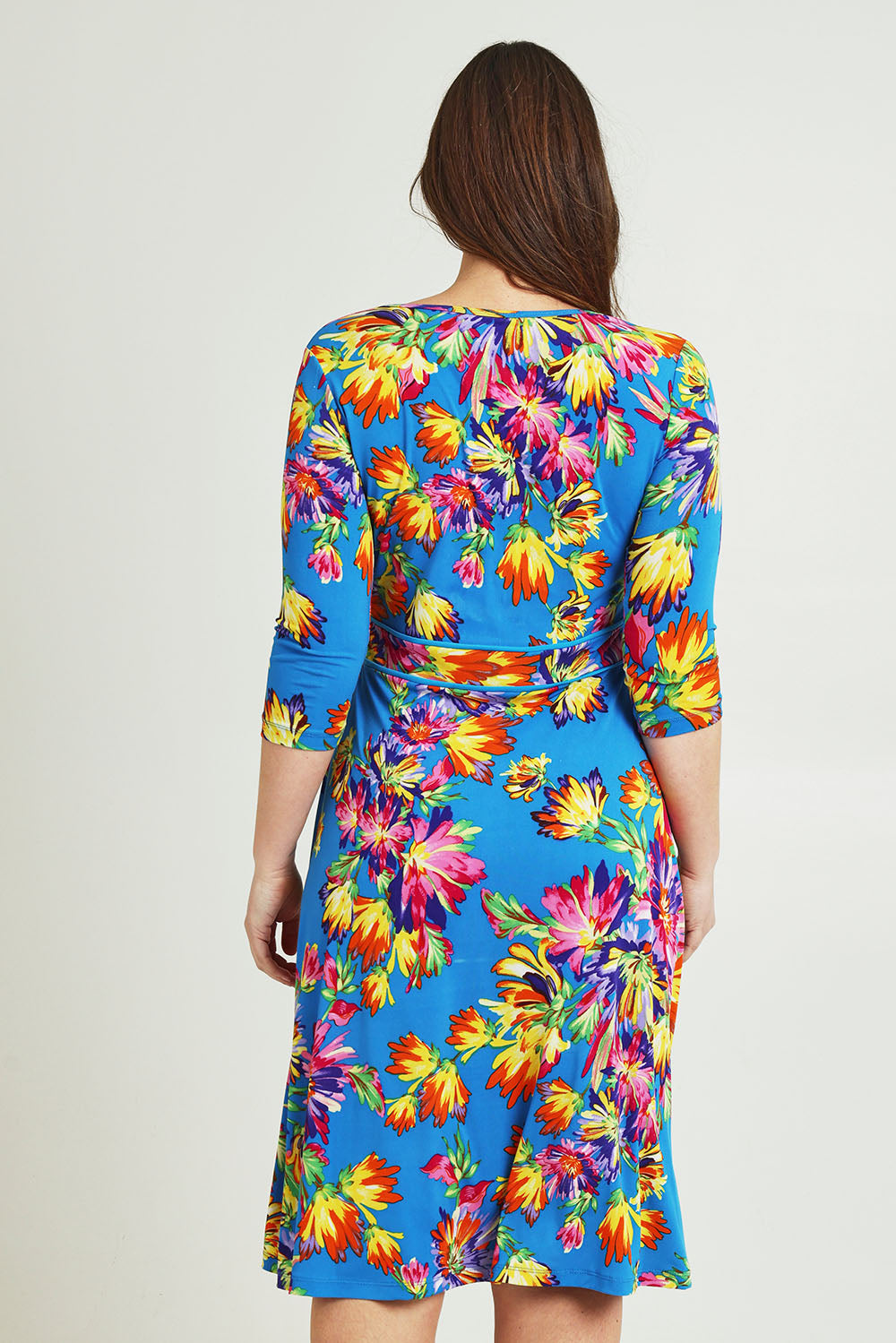 Model Jane wearing size 14 of the Printed 3/4 Sleeve Faux Wrap Dress in colour Garden (Blue), from the back