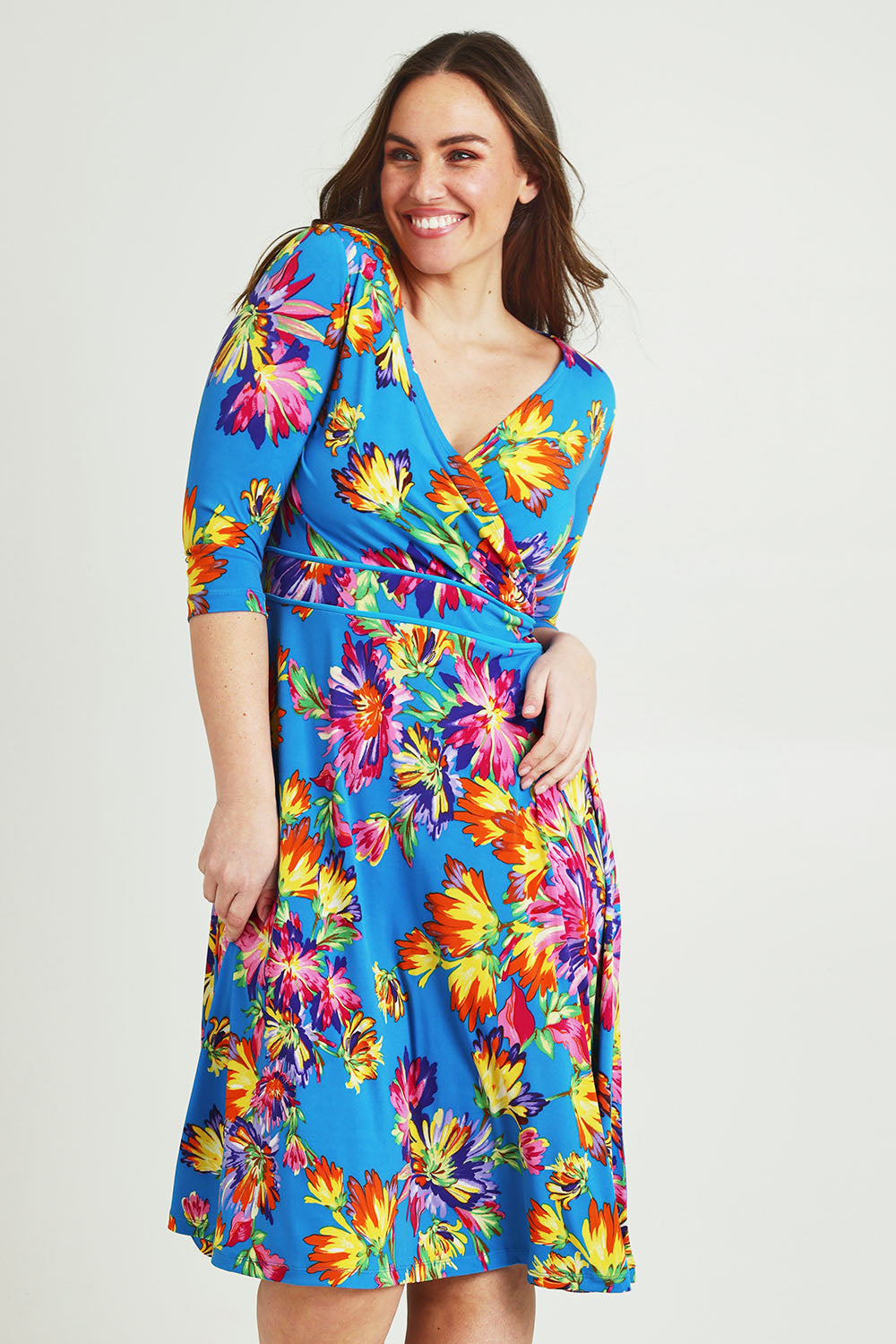 Model Jane wearing size 14 of the Printed 3/4 Sleeve Faux Wrap Dress in colour Garden (Blue), from the front, cropped image