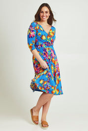 Model Jane wearing size 14 of the Printed 3/4 Sleeve Faux Wrap Dress in colour Garden (Blue), from the front, showing the whole outfit
