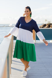 Model Laura wearing size 14 of the Multi Colour Tier Dress in colour Multi (Blue), from the front, showing the whole outfit