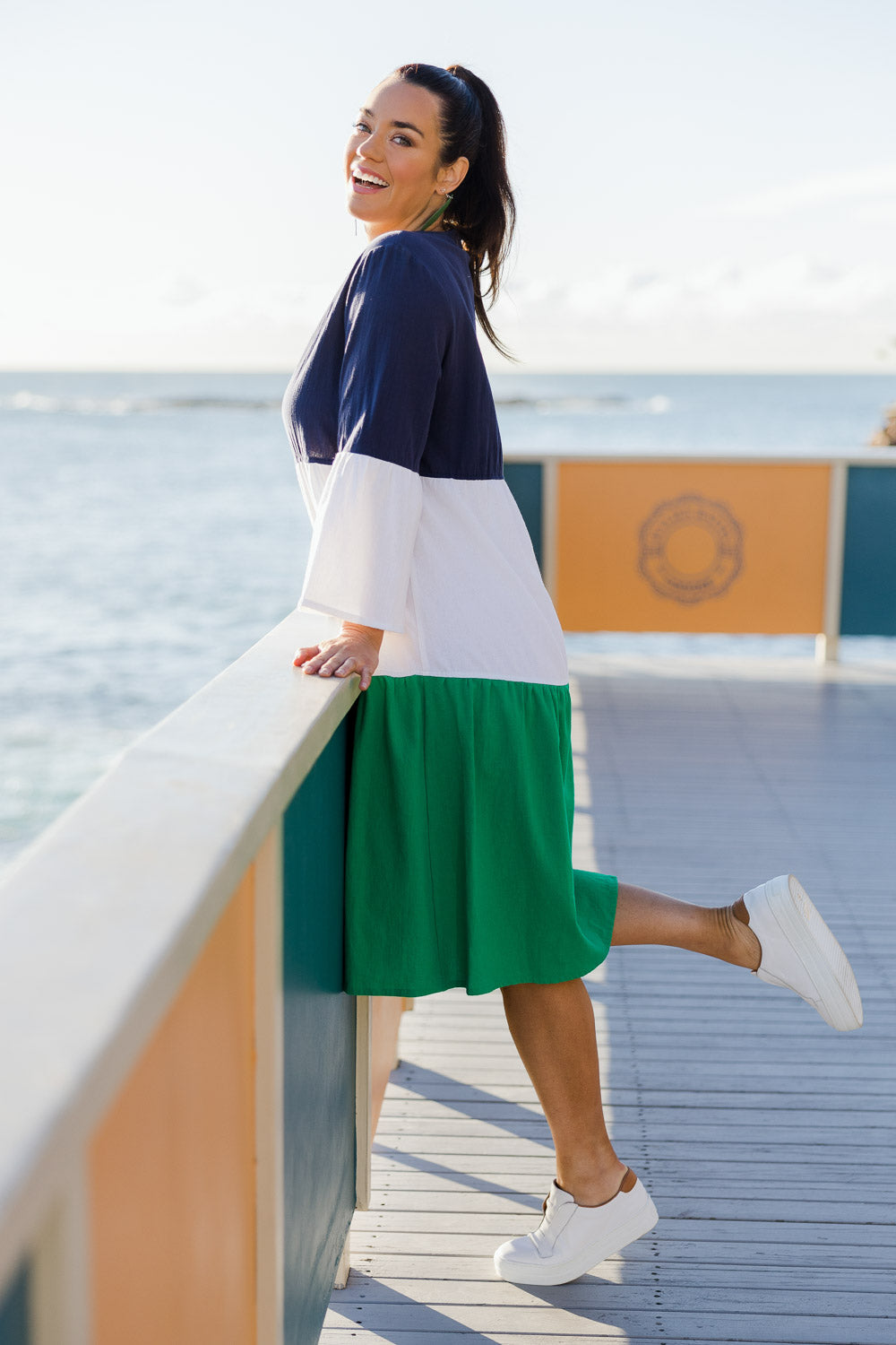 Model Laura wearing size 14 of the Multi Colour Tier Dress in colour Multi (Blue), from the front, showing the whole outfit