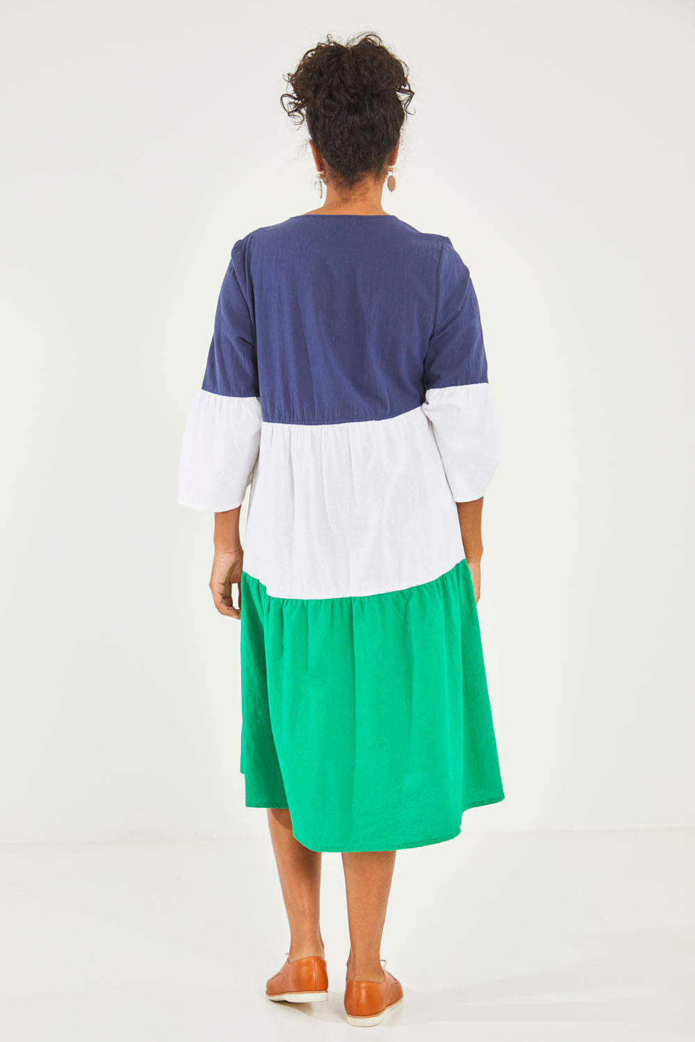 Model Noli wearing size 14 of the Multi Colour Tier Dress in colour Multi (Blue), from the back
