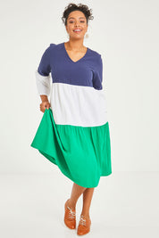 Model Noli wearing size 14 of the Multi Colour Tier Dress in colour Multi (Blue), from the front, showing the whole outfit