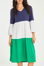 Model Stacey wearing size 10 of the Multi Colour Tier Dress in colour Multi (Blue), from the front, cropped image