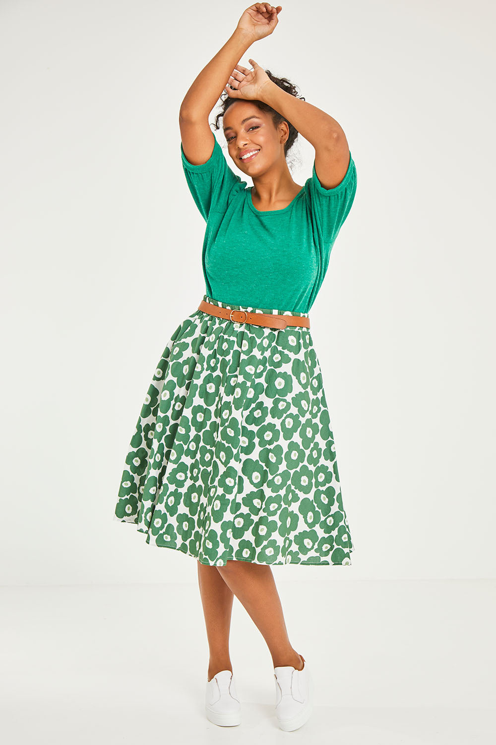 Model Noli wearing size 14 of the Calf Length Gathered Skirt in colour Daisy (Green), from the front, showing the whole outfit