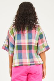 Model Noli wearing size 14 of the Bell Sleeve Top in colour Check (Blue), from the back