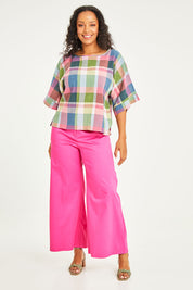 Model Noli wearing size 14 of the Bell Sleeve Top in colour Check (Blue), from the front, showing the whole outfit