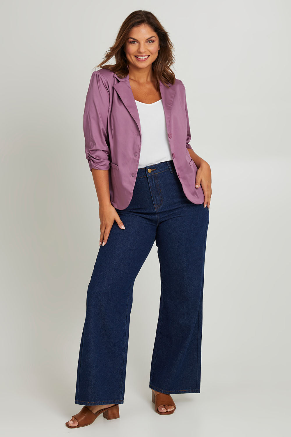 Model Monique wearing size 14 of the Buttoned Blazer in colour Mauve (Purple), from the front, showing the whole outfit