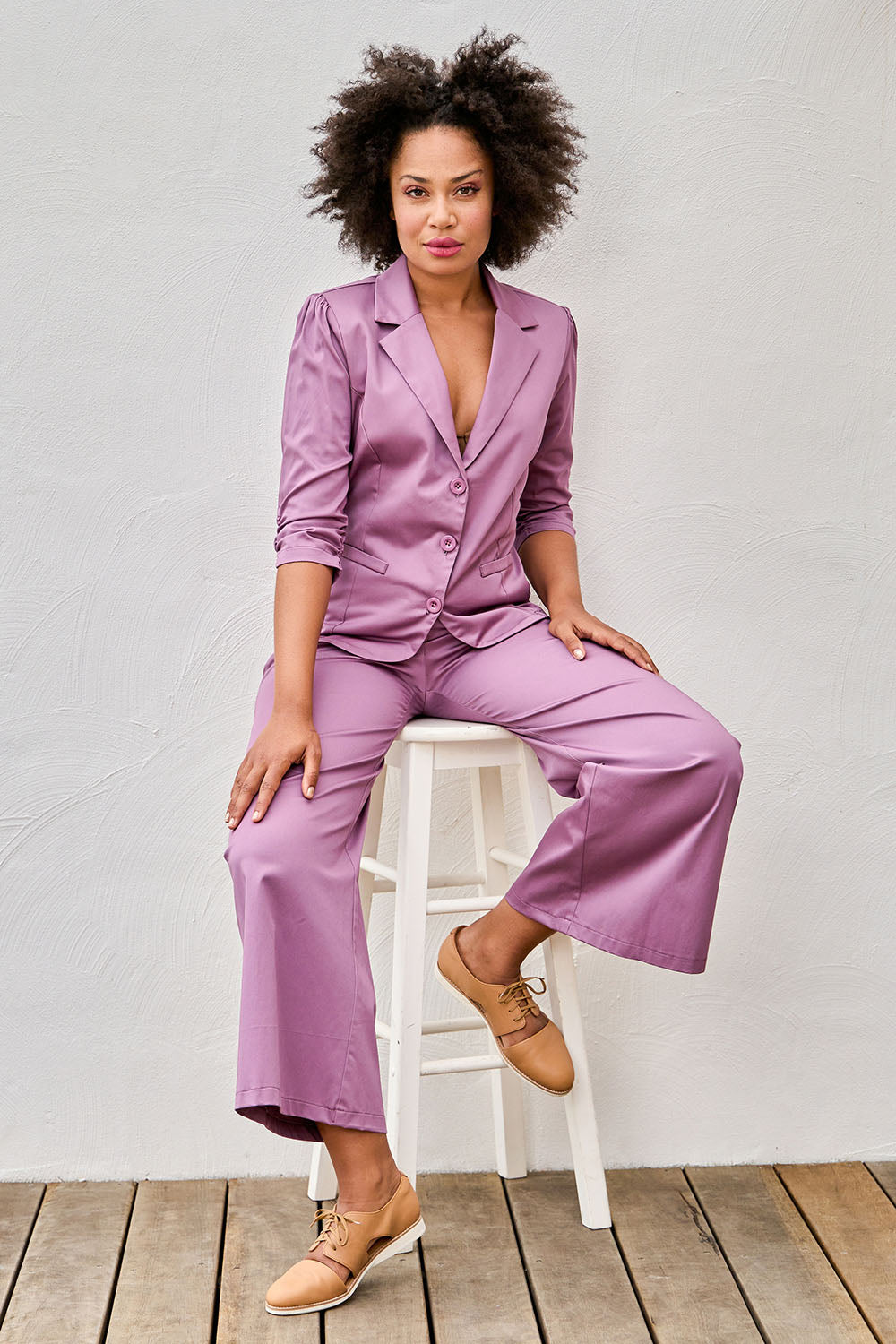 Model Olivia wearing size 10 of the Buttoned Blazer in colour Mauve (Purple), from the front, showing the whole outfit