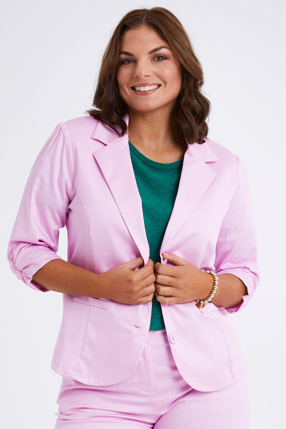 Model Monique wearing size 14 of the Buttoned Blazer in colour Softpink (Pink), from the front, cropped image
