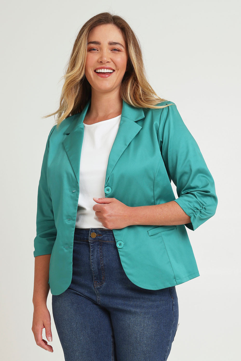 Model Chanel wearing size 16 of the Buttoned Blazer in colour Teal (Blue), from the front, cropped image