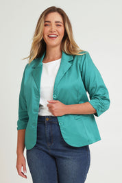 Model Chanel wearing size 16 of the Buttoned Blazer in colour Teal (Blue), from the front, cropped image