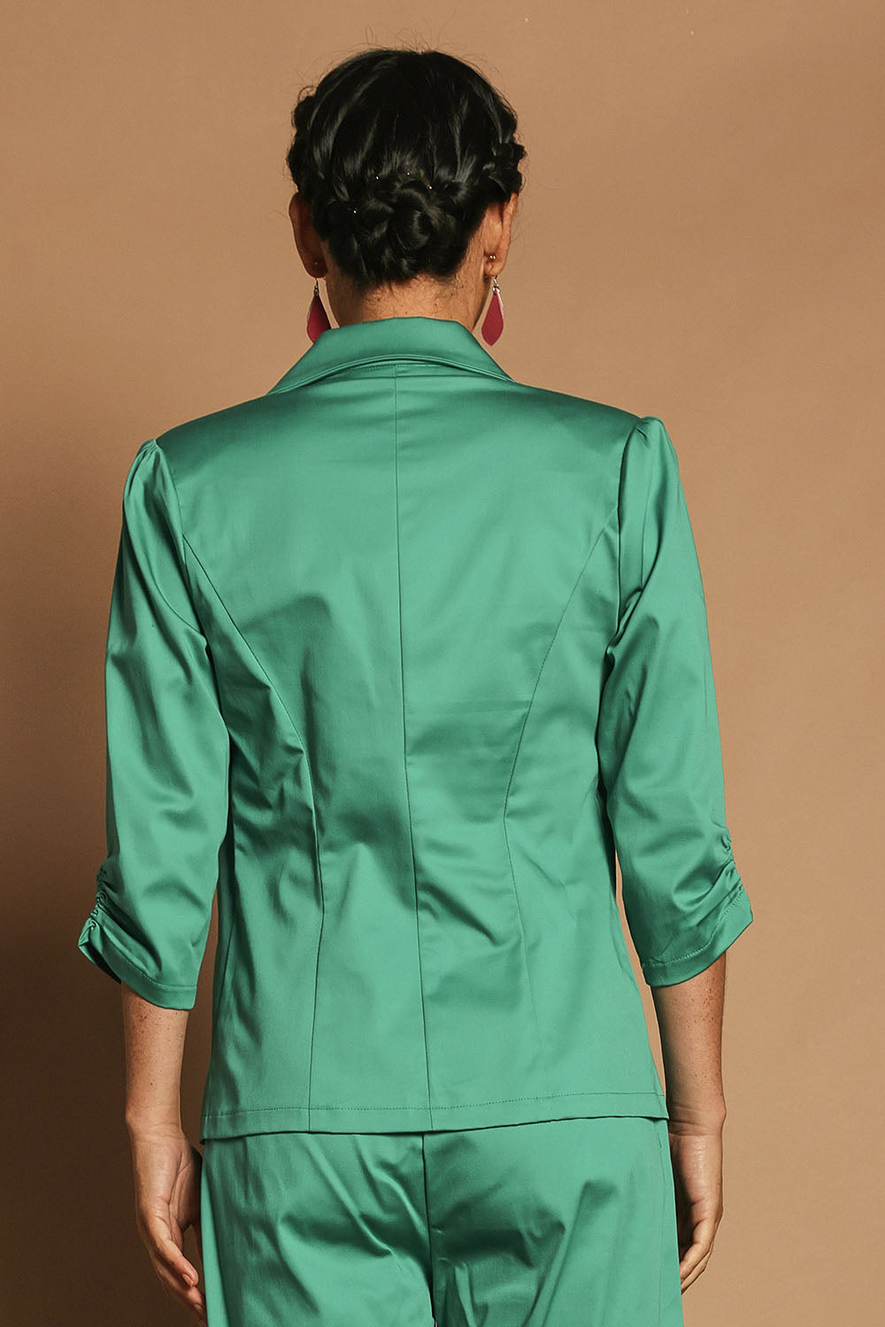 Model Katie wearing size 10 of the Buttoned Blazer in colour Teal (Blue), from the back