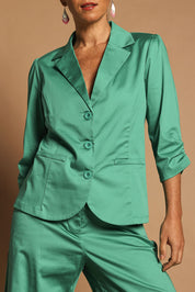 Model Katie wearing size 10 of the Buttoned Blazer in colour Teal (Blue), from the front, cropped image