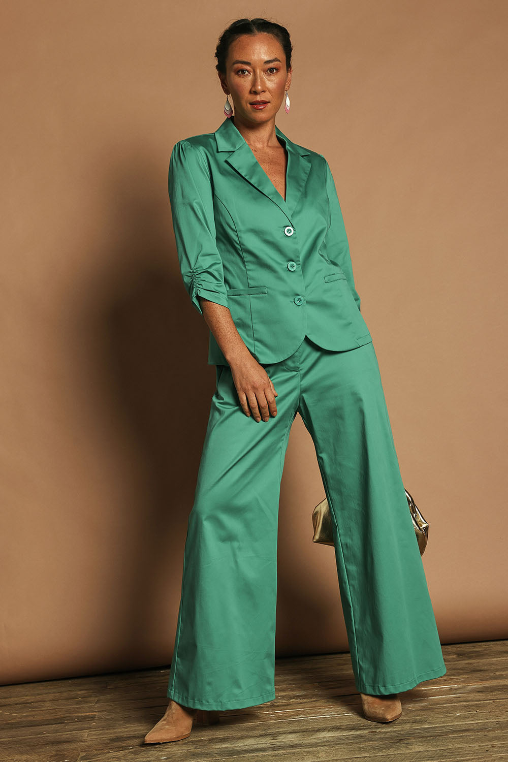 Model Katie wearing size 10 of the Buttoned Blazer in colour Teal (Blue), from the front, showing the whole outfit