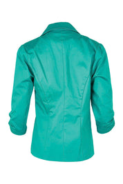 Product shot of the Buttoned Blazer in colour Teal (Blue), from the back