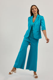 Model Amanda wearing size 10 of the Buttoned Blazer in colour Turquoise (Blue), from the front, showing the whole outfit