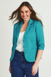 Model Jane wearing size 14 of the Buttoned Blazer in colour Turquoise (Blue), from the front, cropped image