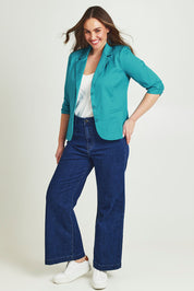 Model Jane wearing size 14 of the Buttoned Blazer in colour Turquoise (Blue), from the front, showing the whole outfit