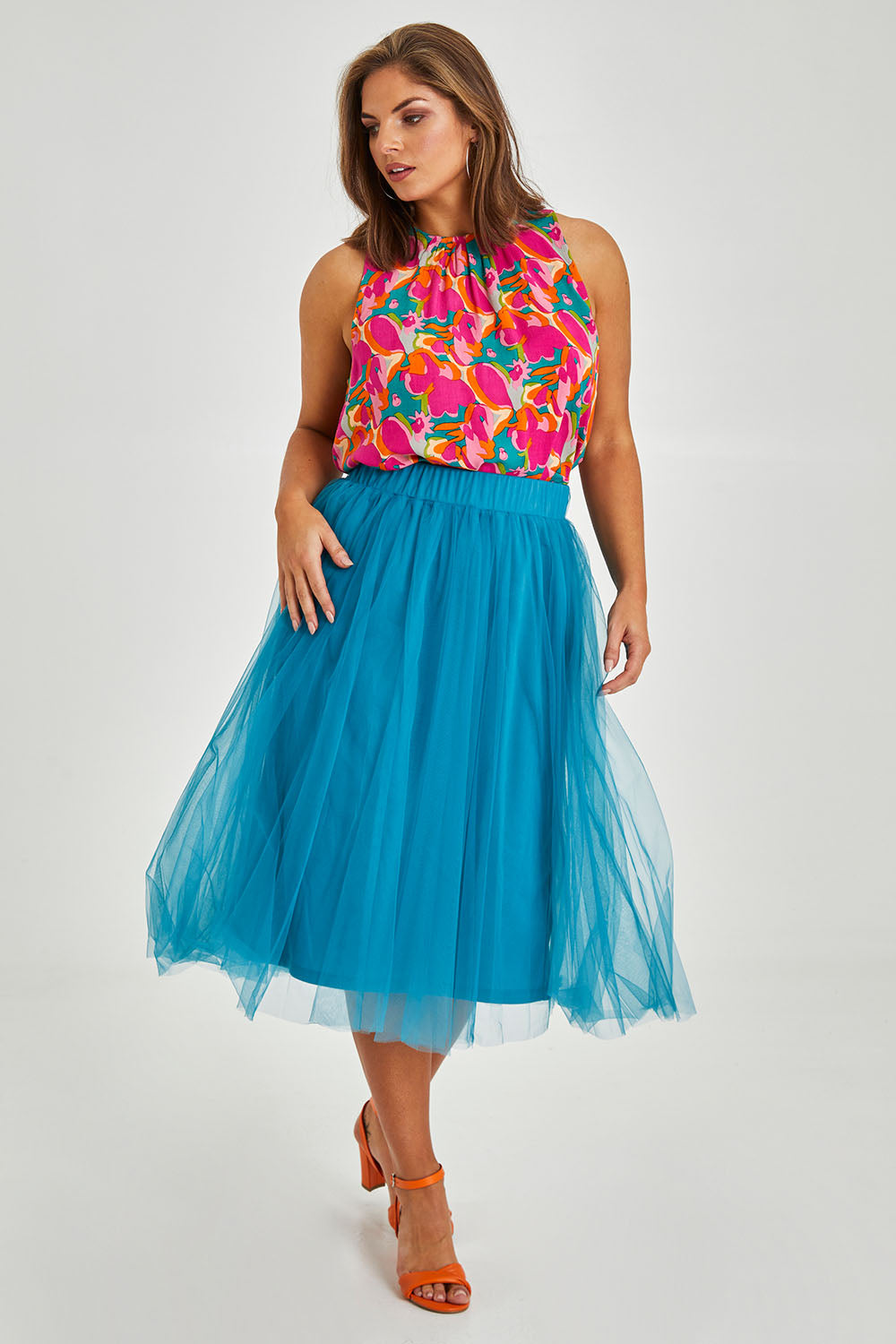Model Monique wearing size 14 of the Sleeveless Tank in colour Boldfloral (Pink), from the front, showing the whole outfit