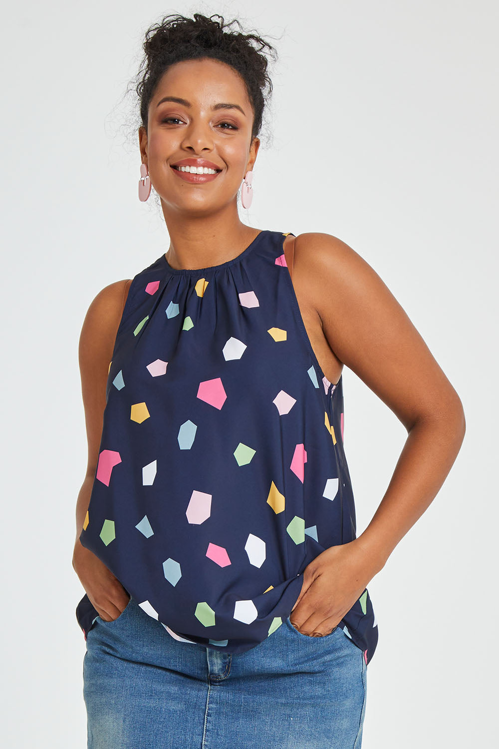 Model Noli wearing size 14 of the Sleeveless Tank in colour Jigsaw (Blue), from the front, cropped image