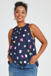 Model Noli wearing size 14 of the Sleeveless Tank in colour Jigsaw (Blue), from the front, cropped image