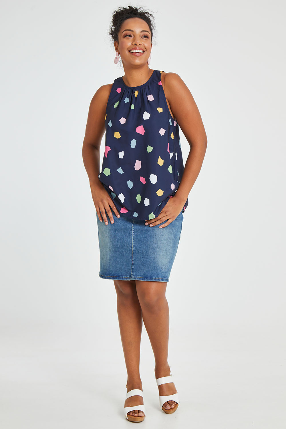 Model Noli wearing size 14 of the Sleeveless Tank in colour Jigsaw (Blue), from the front, showing the whole outfit