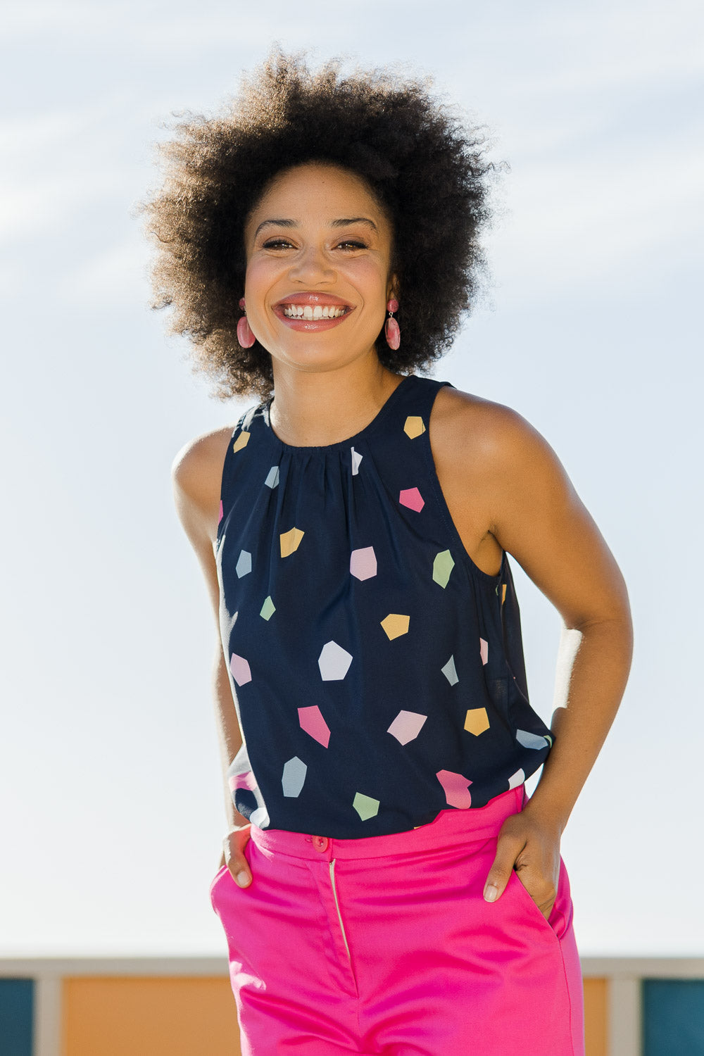 Model Olivia wearing size 10 of the Sleeveless Tank in colour Jigsaw (Blue), from the front, showing the whole outfit