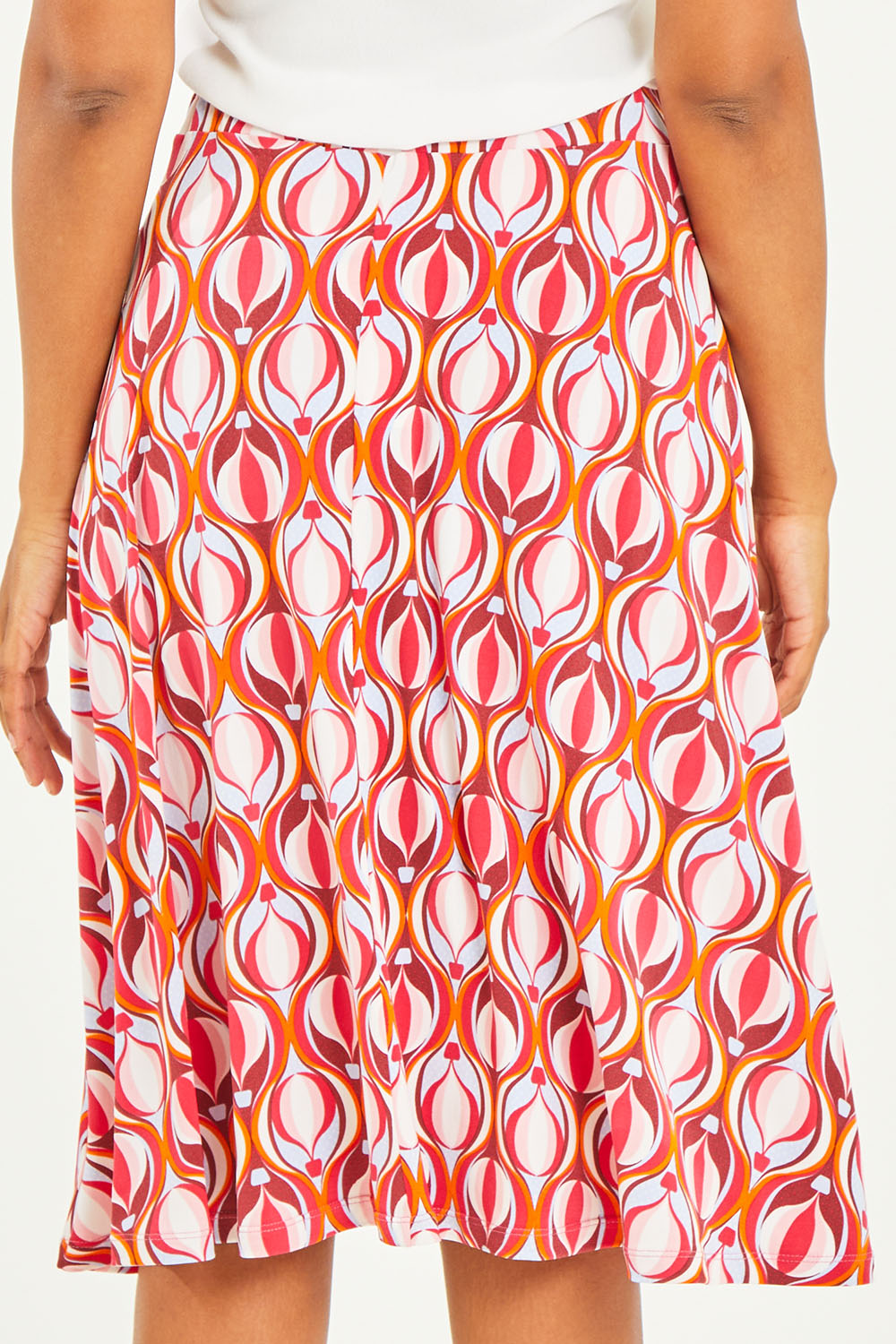 Model Noli wearing size 14 of the Printed Calf Length Gathered Waist Skirt in colour Balloons (Pink), from the back
