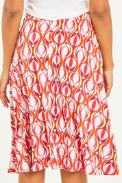 Model Noli wearing size 14 of the Printed Calf Length Gathered Waist Skirt in colour Balloons (Pink), from the back