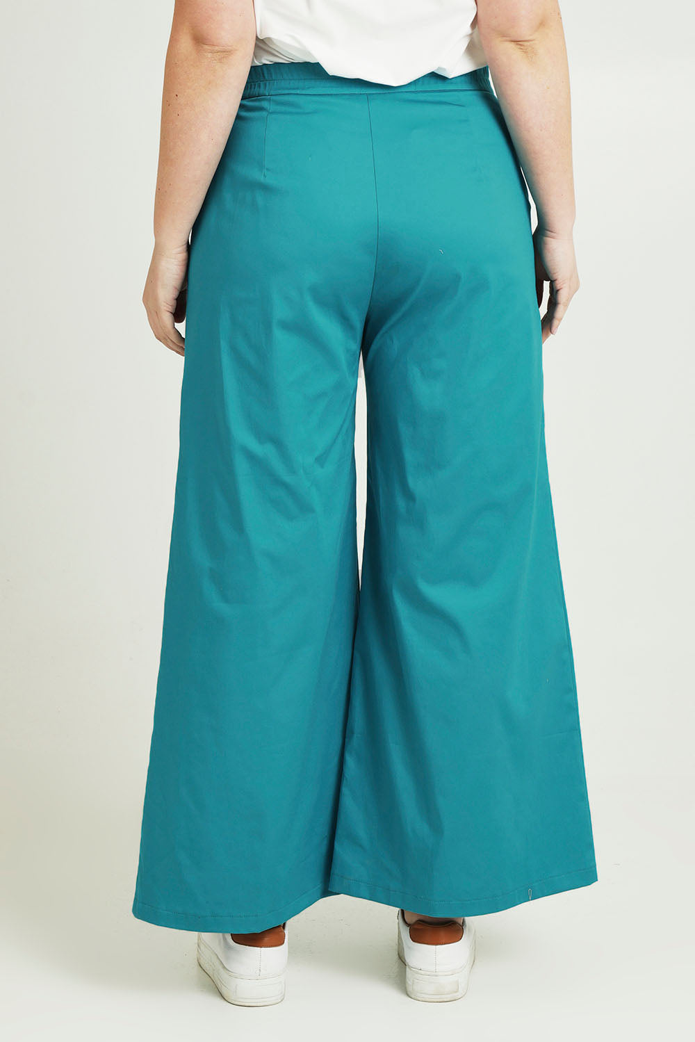 Model Jane wearing size 14 of the Wide Leg Pant in colour Turquoise (Blue), from the back