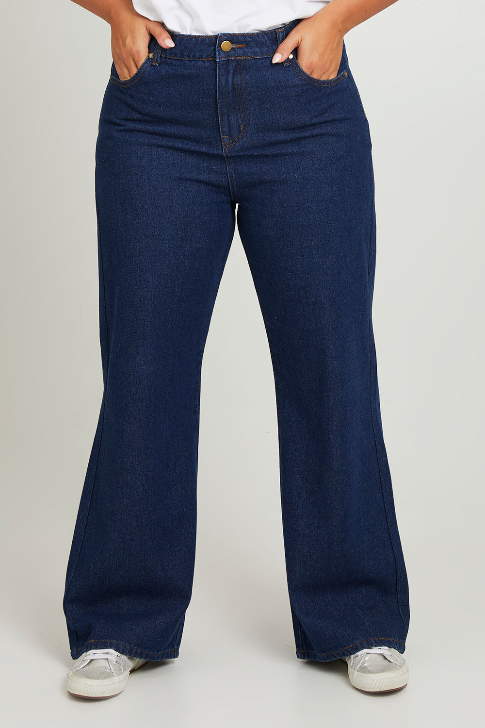 Model Monique wearing size 14 of the Patch Denim High Waist Jeans in colour Heart (Blue), from the front, cropped image