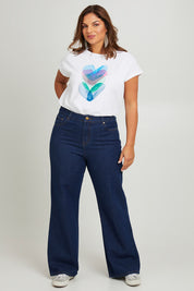 Model Monique wearing size 14 of the Patch Denim High Waist Jeans in colour Heart (Blue), from the front, showing the whole outfit
