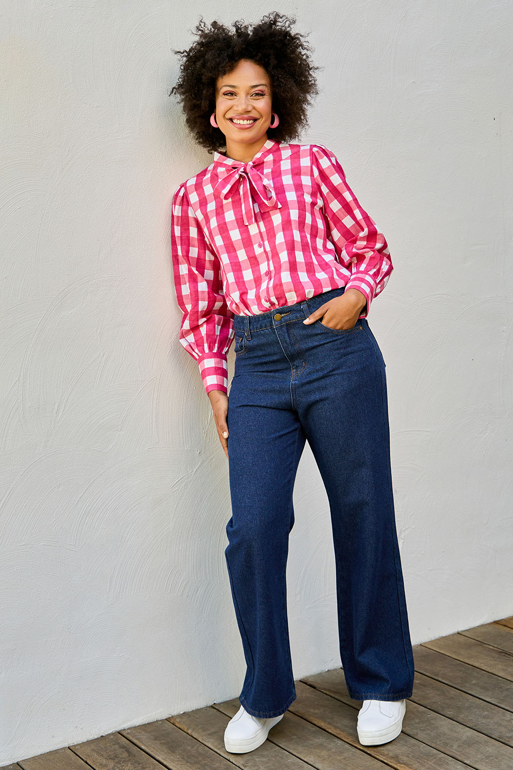 Model Olivia wearing size 10 of the Patch Denim High Waist Jeans in colour Heart (Blue), from the front, showing the whole outfit