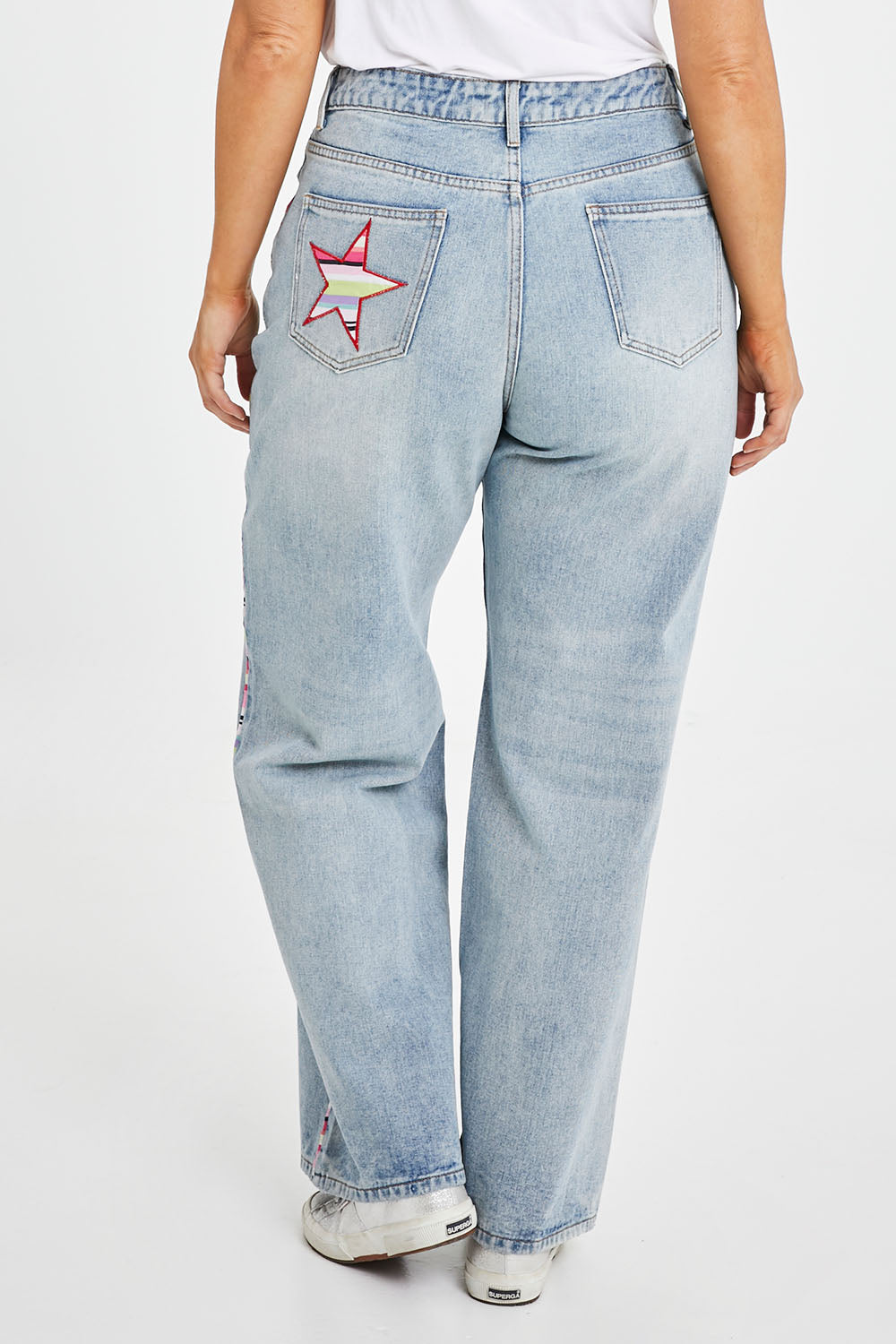 Model Laura wearing size 14 of the Patch Denim High Waisted Jeans in colour Denim (Blue), from the back