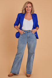 Model Sandy wearing size 10 of the Patch Denim High Waisted Jeans in colour Denim (Blue), from the front, showing the whole outfit