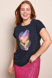 Model Georgiel wearing size 10 of the Heart Logo Tee – Blackpink in colour Blackpink, in a cropped view