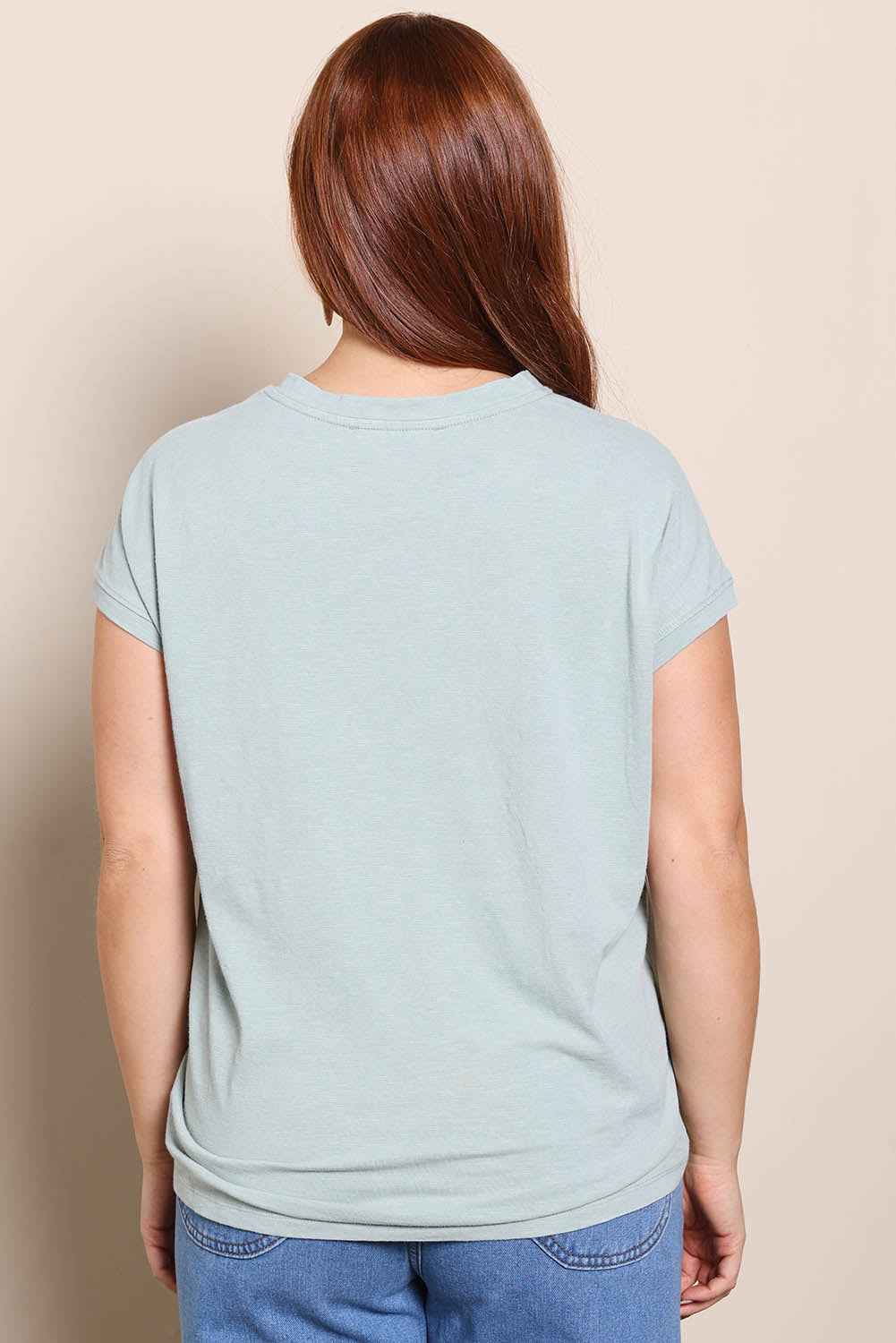 Model Georgiel wearing size 10 of the Heart Logo Tee – Tealred in colour Tealred, from the back