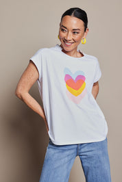 Model Katie wearing size 10 of the Heart Logo Tee in colour Yelloheart, from the front, cropped image