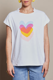 Model Katie wearing size 10 of the Heart Logo Tee in colour Yelloheart, from the front, cropped image