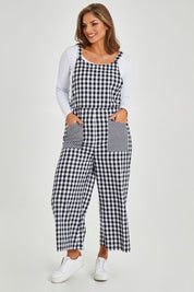 Model Monique wearing size 14 of the Cropped Overalls in colour Blackwhite (Black), from the front, showing the whole outfit