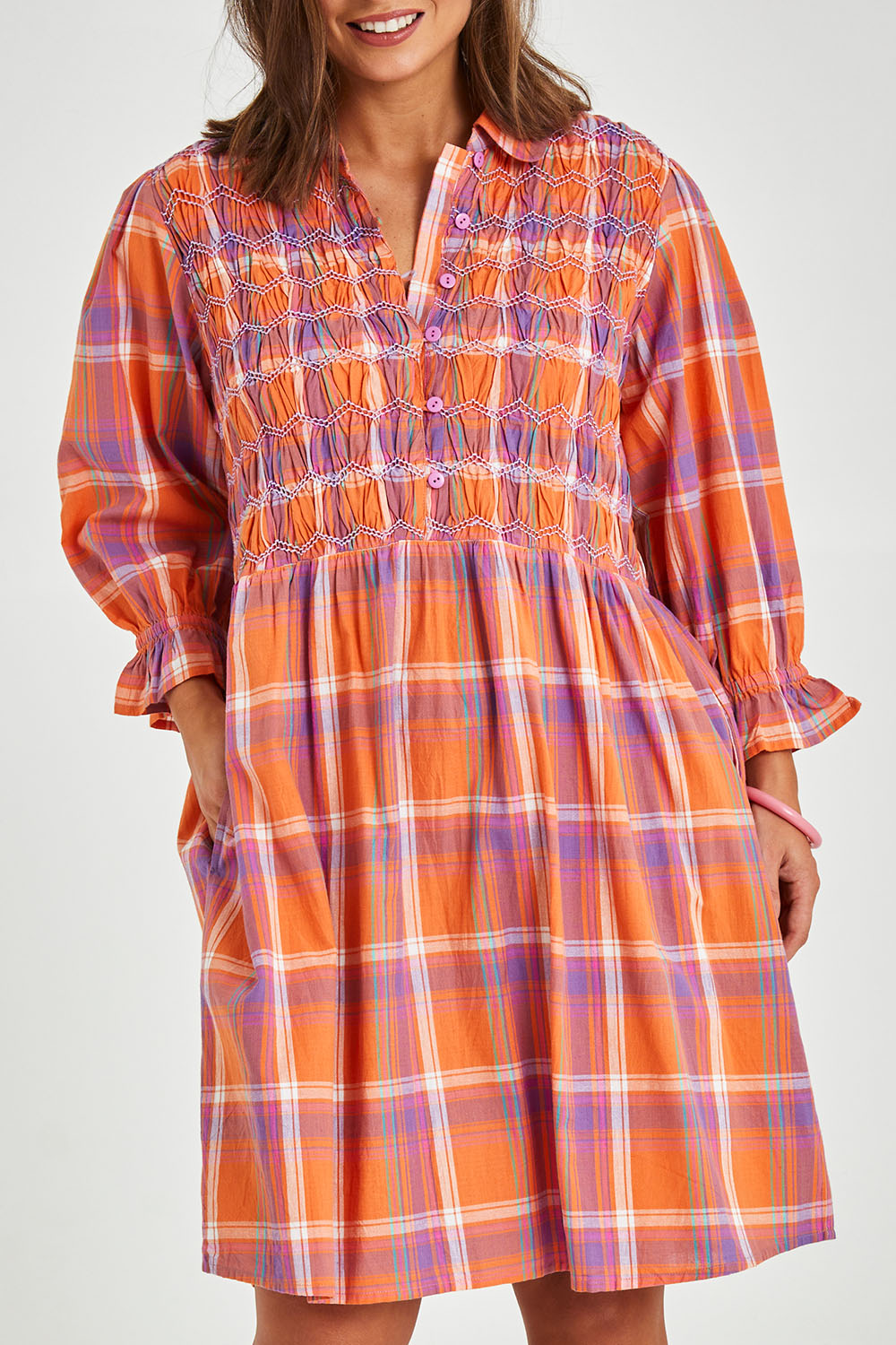 Model Monique wearing size 14 of the Shirred Bodice Detail Dress in colour Checked, from the front, cropped image
