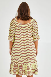 Model Monique wearing size 14 of the Stitch Detail Ruffle Sleeve Dress in colour Limechoc, from the back