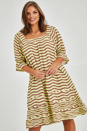 Model Monique wearing size 14 of the Stitch Detail Ruffle Sleeve Dress in colour Limechoc, from the front, cropped image