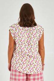 Model Monique wearing size 14 of the Cap Sleeve Shirt in colour Retrodaisy (White), from the back